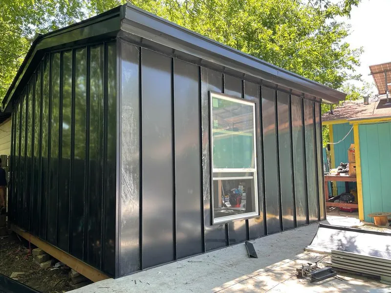 Black standing seam metal wall panels for Roof Inspection in St. Martin