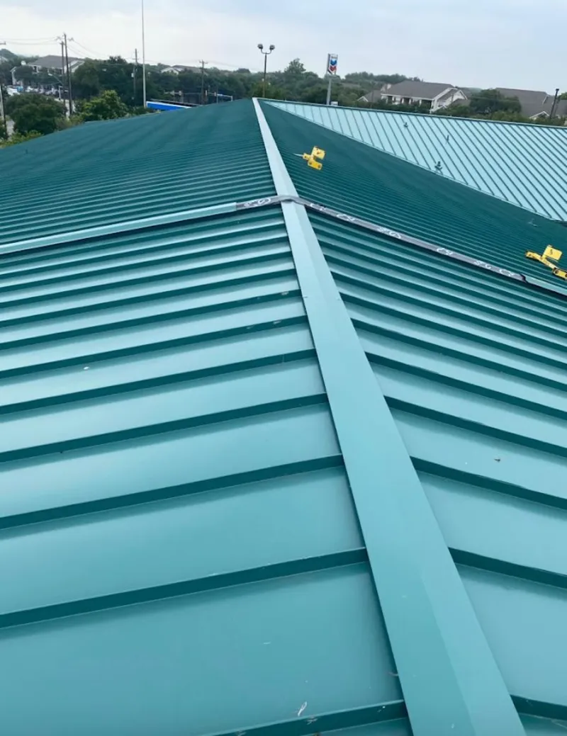 Green commercial metal roof ridge and valley for Metal Roof Repair in St. Martin