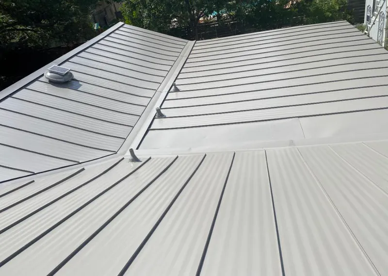 Solar attic fan installed on a metal roof for Roof Ventilation in St. Martin